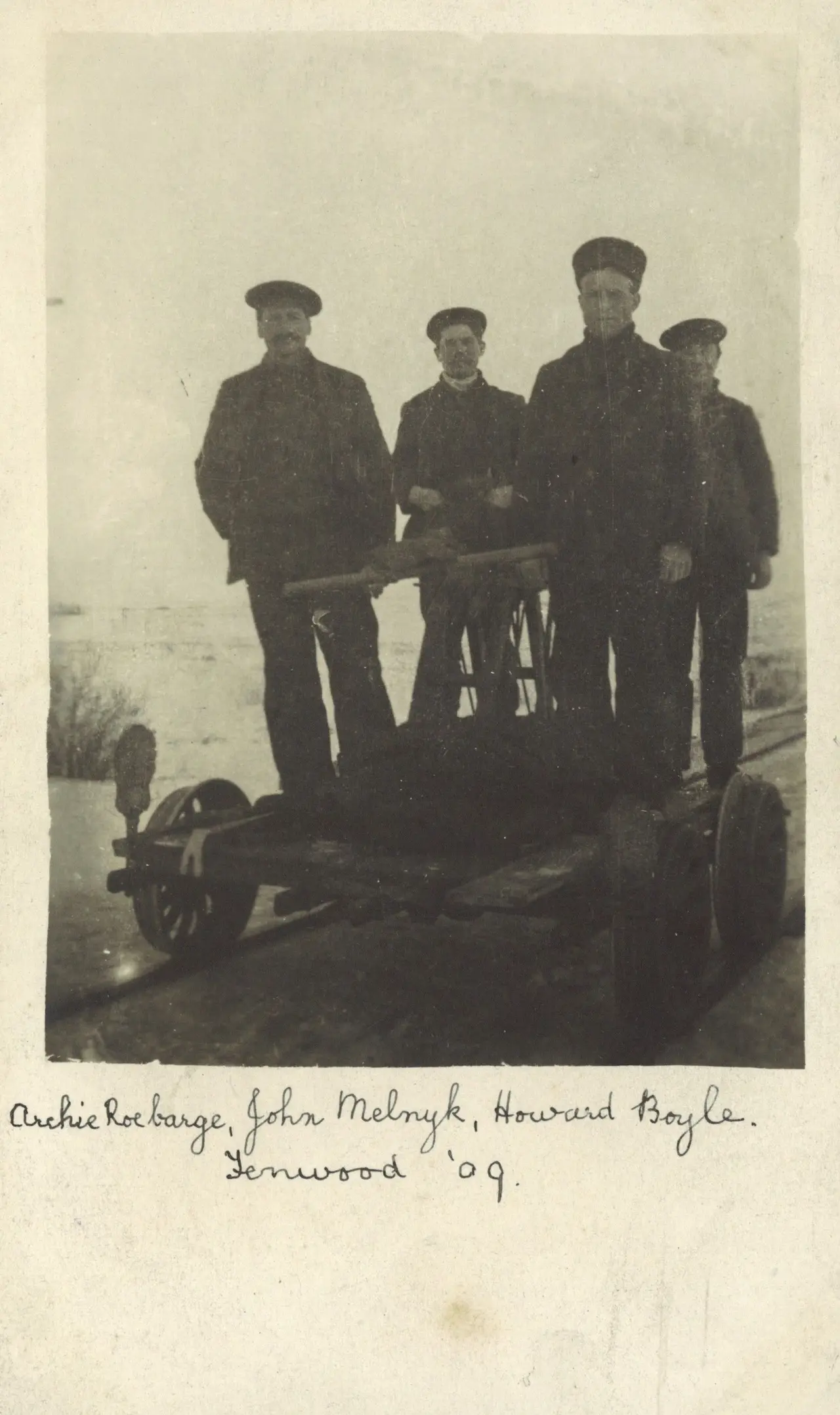 Four men on a railway handcar at Fenwood, 1909